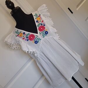 umgee sz L baby doll floral embroidery cotton top with fringe